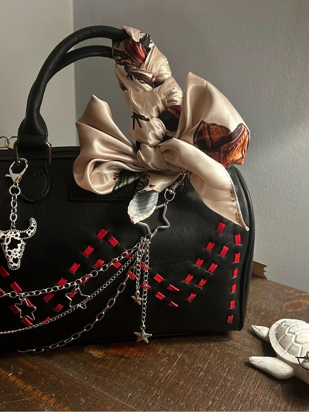 Black Satchel Handbag with Red Accents and Cream Bow